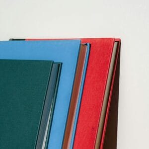 a stack of books sitting next to each other